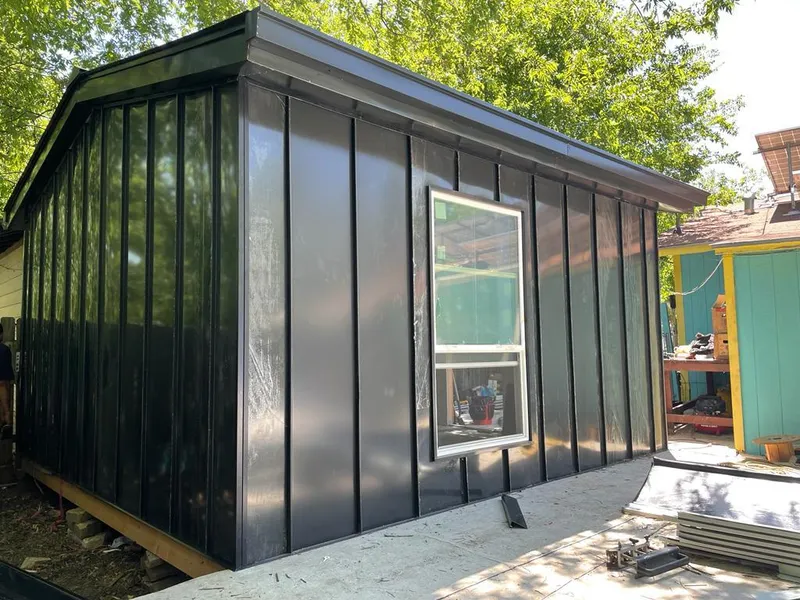 Black standing seam metal wall panels for Metal Roof Installation in Inwood