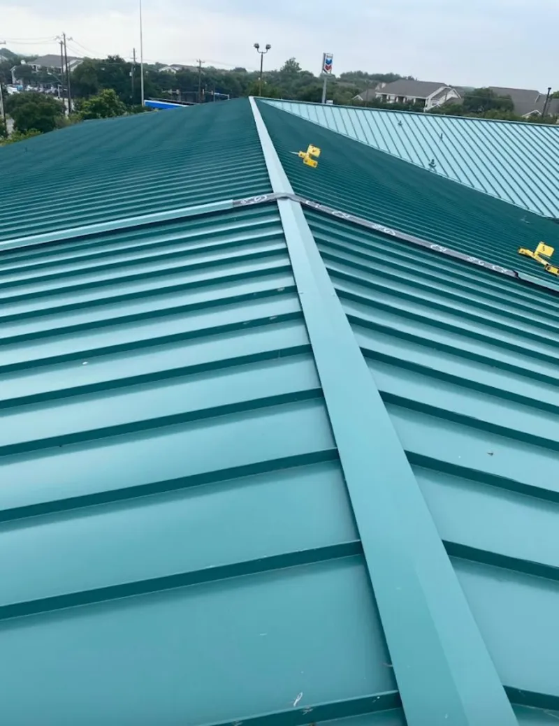 Green commercial metal roof ridge and valley for Metal Roof Repair in Inwood